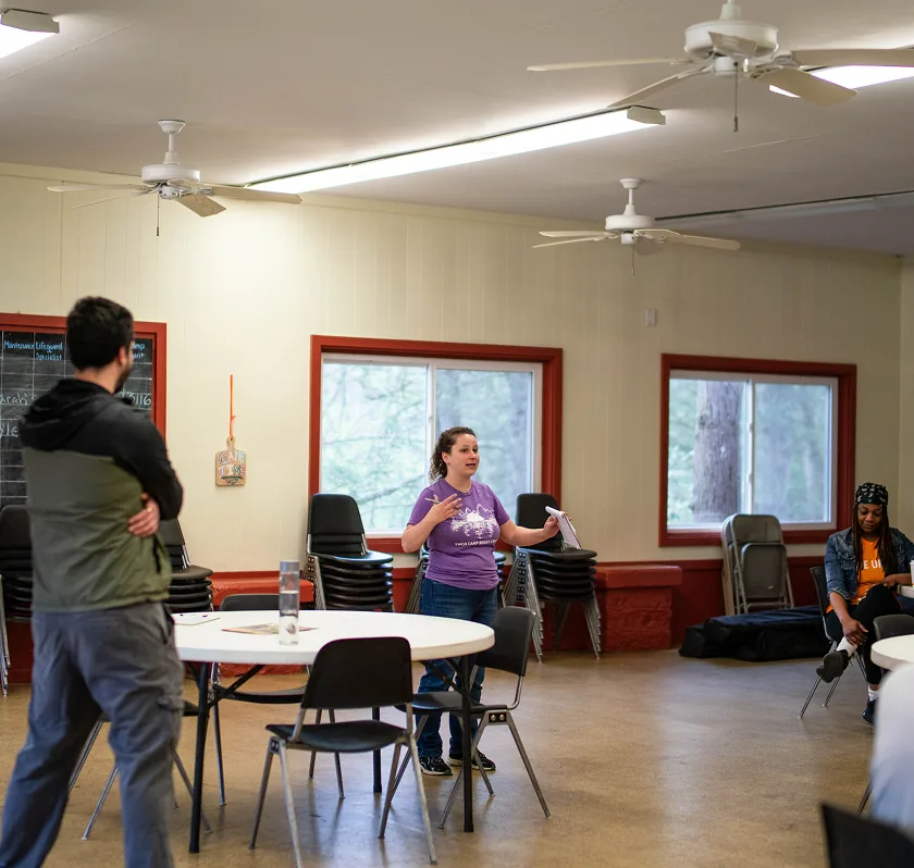 Group discussion in a bright, casual meeting room with participants engaged and focused.